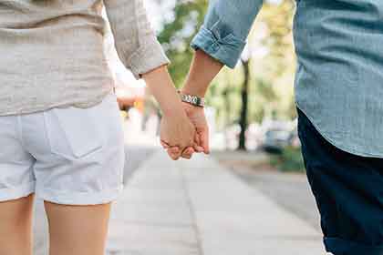 Closeup of a couple holding hands